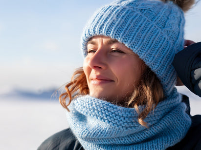 woman wearing winter hat and scarf