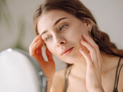 woman looking in the mirror