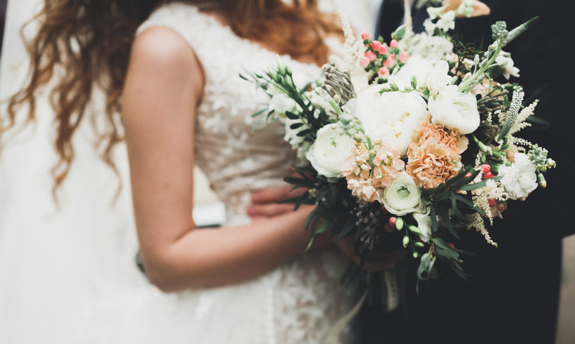 woman holding bouquet at wedding
