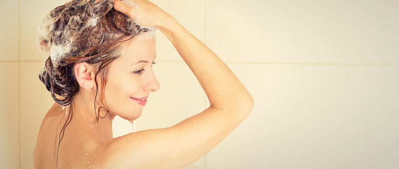 woman using shampoo bar
