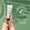 A hand holds a tube of Green People Firming Vitamin C Eye Serum 10ml against a green background with a dermatologically tested badge.
