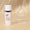 A white bottle of Age Defy+ Brightening Moisturiser stands on a neutral beige background alongside a dermatologically tested seal.