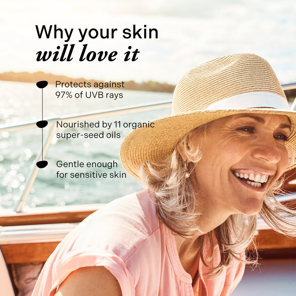 Happy woman with straw hat on boat, sunlight on hair and face, with text overlay.