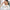 Thumbnail for Asian woman applying moisturizer to her forehead with both hands in a bathroom setting, a customer review in the foreground. image