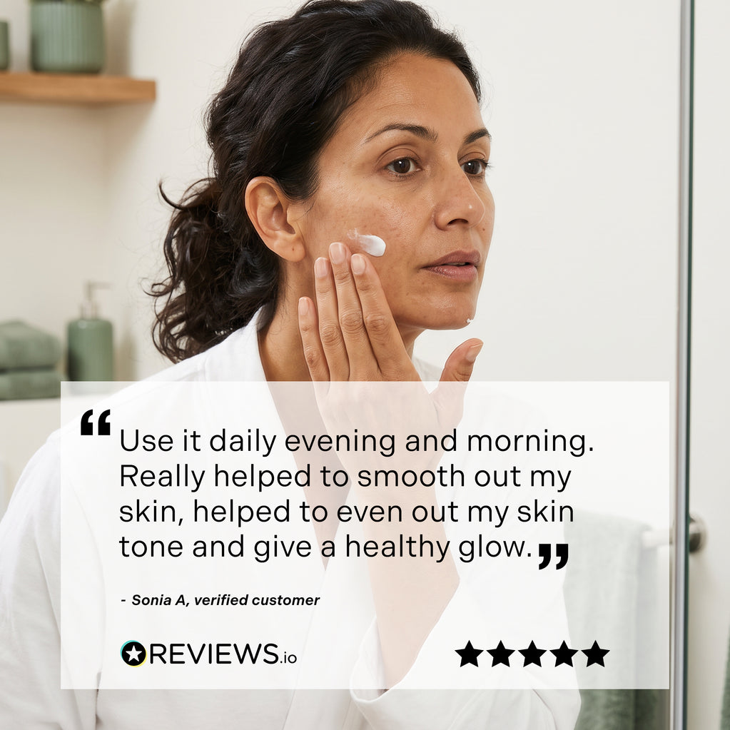 A woman applies Age Defy+ Collagen Boost Vitamin C Serum 30ml to her cheek in the mirror beside a five-star review overlay.