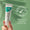 A hand holds a tube of Oy Clear Skin Purifying Serum against a soft green background featuring a dermatologically tested badge.
