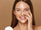 A woman applying a vegan moisturiser